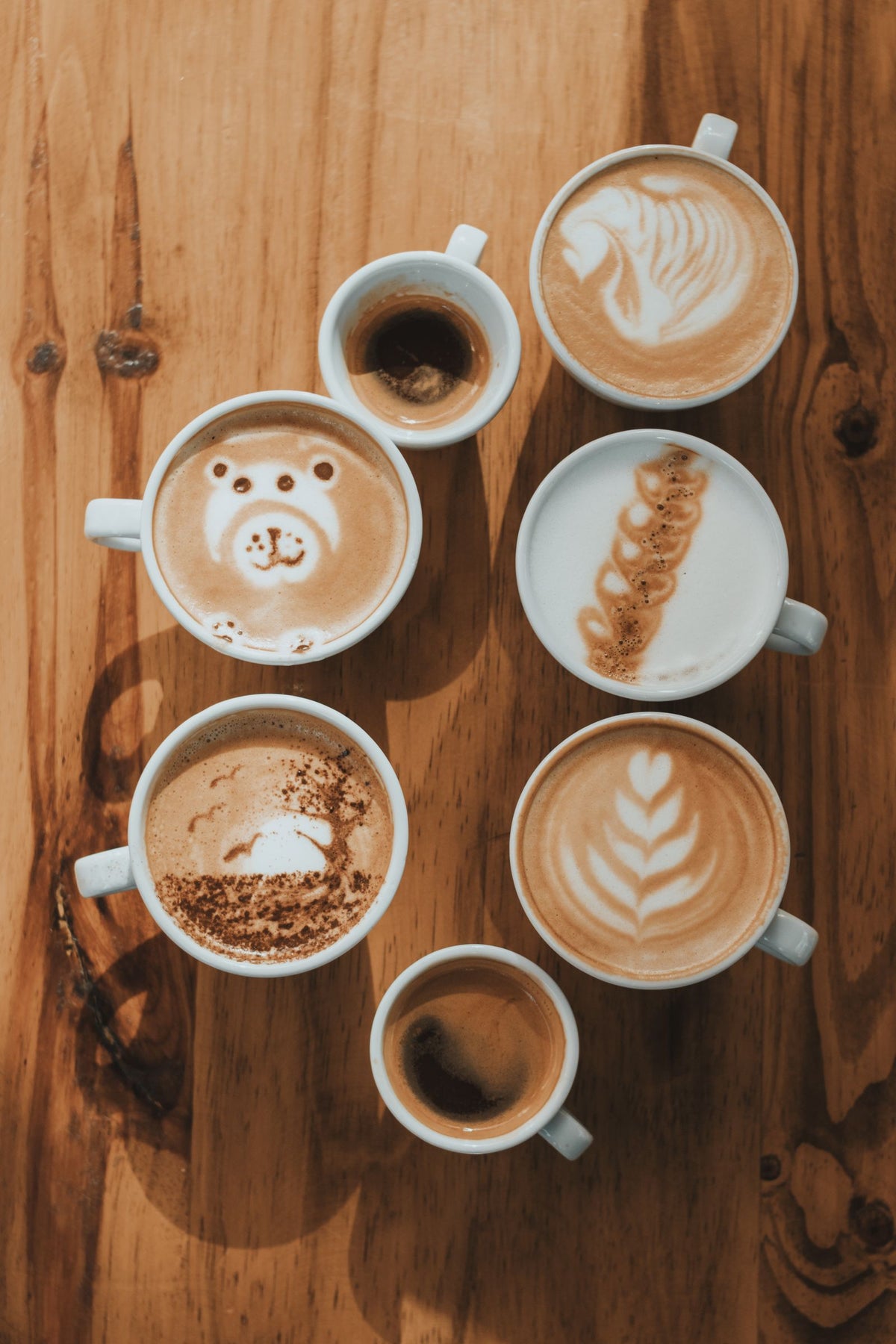 A variety of coffee drinks in different cups